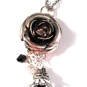 Girl Next Door. Metal Silver Rose Pendant with Floral Charms and Black Crystal Accents Necklace