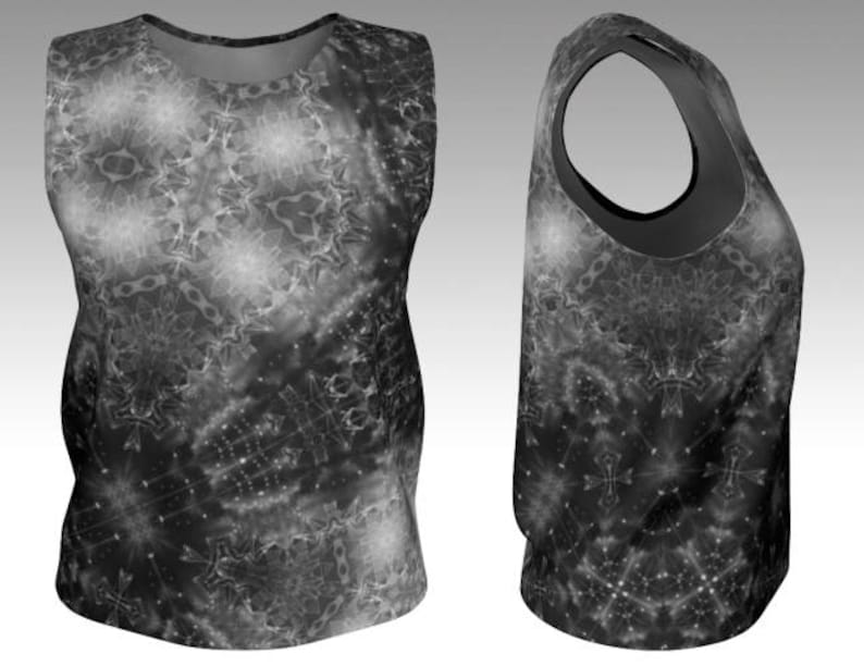 May include: Sleeveless tank top with a black and white abstract pattern. The design features a complex arrangement of geometric shapes and starburst-like elements, creating a visually dynamic effect. The top has a scoop neck and a racerback design.