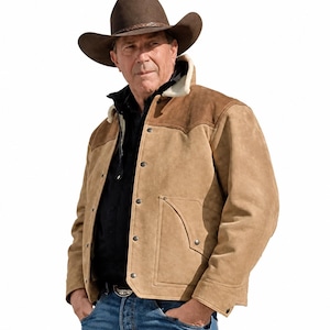 May include: A tan suede jacket with a white shearling collar, dark brown shoulder panels, and metal snap buttons, worn over a black shirt and blue jeans, paired with a dark brown felt cowboy hat with a braided leather hatband.
