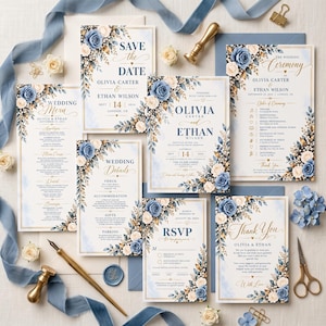 May include: A wedding stationery set featuring blue and cream floral accents, including a Save the Date, invitation, menu, details card, RSVP, and thank you card. The cards display elegant typography and gold-toned text on a white background.