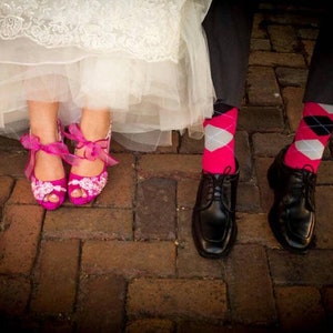 Magenta wedding color, bride and groom wearing fuchsia bridal shoes and socks.