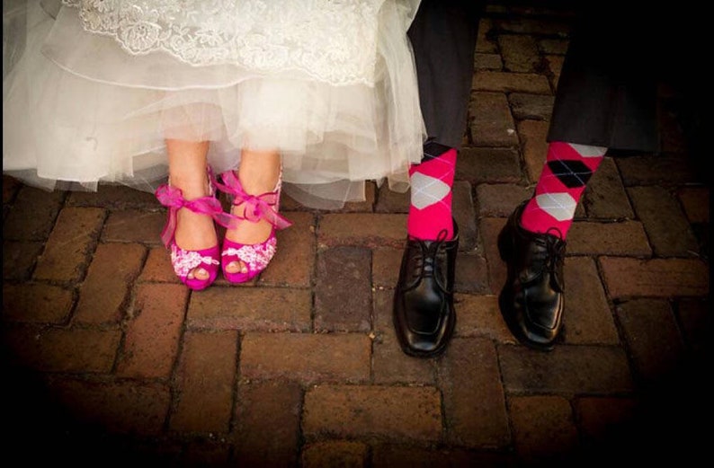 Magenta wedding color, bride and groom wearing fuchsia bridal shoes and socks.