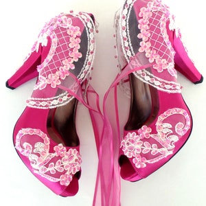 Magenta bridal shoes with floral embellished lace appliques and organza ties. Romantic wedding shoes color pop.