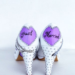 handpainted wedding shoes with lilac hearts on the backs with "just married" and rhinestones on the heels