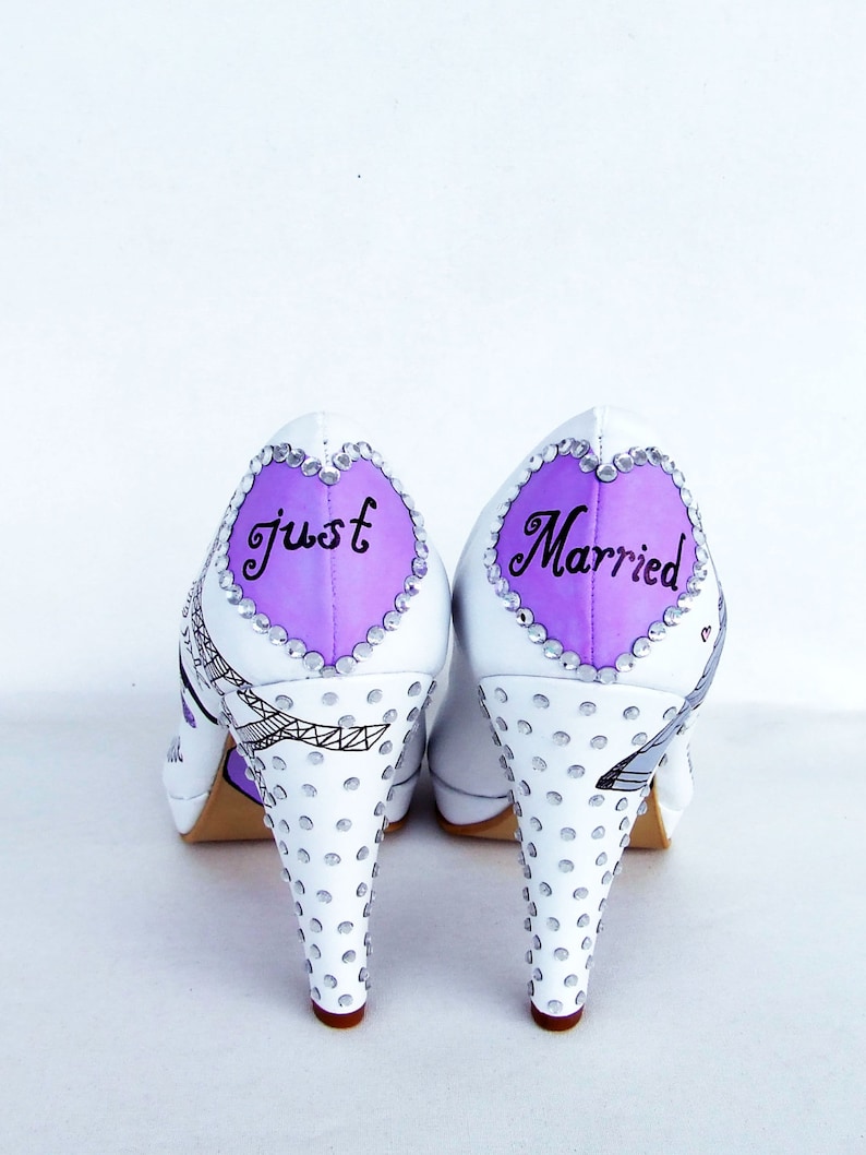 handpainted wedding shoes with lilac hearts on the backs with "just married" and rhinestones on the heels