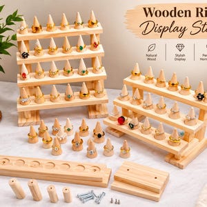 May include: A wooden ring display stand set featuring a tall four-tier rack and a shorter three-tier rack, both with cone-shaped holders. The set includes loose wooden bases, cylindrical pegs, and metal screws for assembly, with text reading Wooden Ring Display Stand.