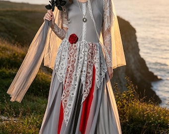 Vestido de novia gótico gris con velo y encaje de calaveras.