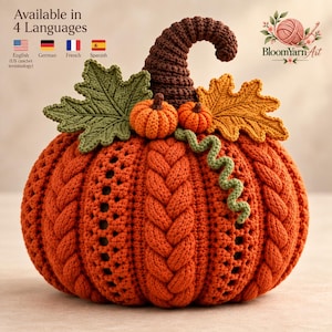 May include: A crocheted orange pumpkin featuring a dark brown stem, two smaller orange pumpkins, a green leaf, a yellow-orange leaf, and a green curly vine. The text reads Available in 4 Languages, English, German, French, Spanish, and BloomYarnArt.