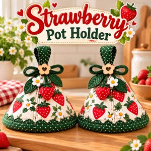 May include: Two cone-shaped pot holders featuring a cream-coloured fabric with a red strawberry and white flower print. Each has a dark green polka-dot trim, a green fabric loop, a wooden flower-shaped button, and a small 3D strawberry accent.