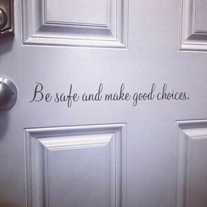 May include: White door with a black vinyl decal that reads "Be safe and make good choices."