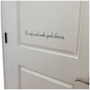 May include: White door with a black vinyl decal that reads "Be safe and make good choices."