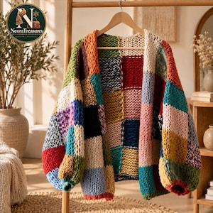 May include: A chunky knit cardigan featuring a patchwork design of large, multi-coloured squares. The garment is constructed from thick yarn in various shades including red, blue, yellow, green, orange, black, white, and pink, with long sleeves.