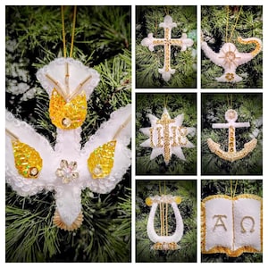 May include: A collection of handmade Christmas ornaments in various shapes, including a dove, cross, star, anchor, lyre, and open book. Each ornament is white with gold accents, sequins, and beads, and is designed to hang on a Christmas tree.