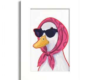 May include: A white duck illustration wearing black sunglasses and a pink headscarf with a dark pink abstract pattern. The duck has a yellow beak and is framed within a white mat border, creating a centered portrait of the bird.