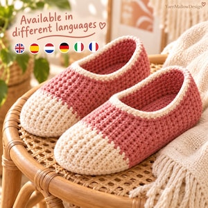 May include: A pair of handmade crochet slippers featuring a two-tone design with a dusty rose main body and a cream-coloured toe section. The slippers have a textured stitch pattern and a cream-coloured trim around the opening for a finished look.