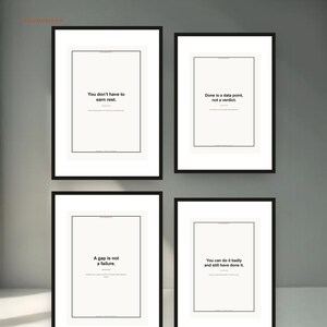 May include: Four framed wall art prints with black frames and white backgrounds. Each print features black text with a red horizontal line. The text reads: You don't have to earn rest, Done is a data point, not a verdict, A gap is not a failure, and You can do it badly and still have done it.