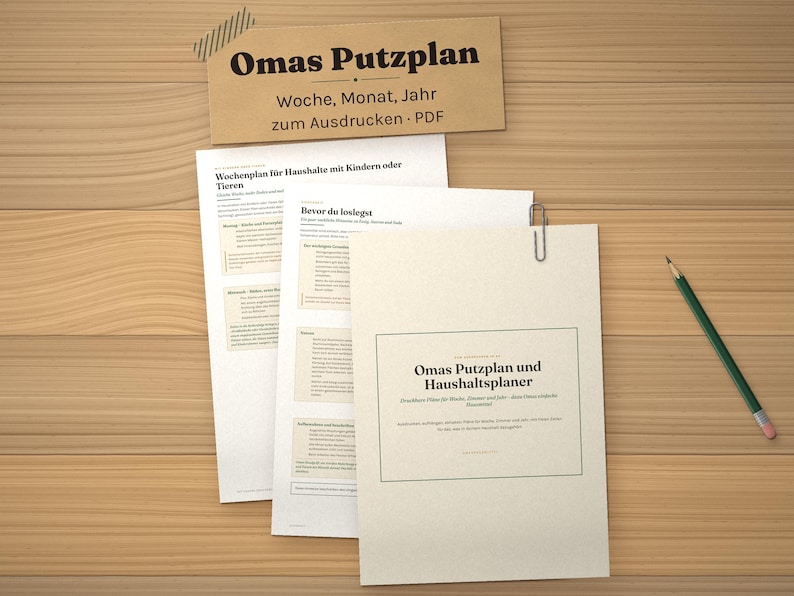 May include: A set of printed cleaning schedule documents titled Omas Putzplan, featuring weekly, monthly, and yearly planning sections. The papers are held together with a metal paperclip, accompanied by a pencil on a wooden surface.