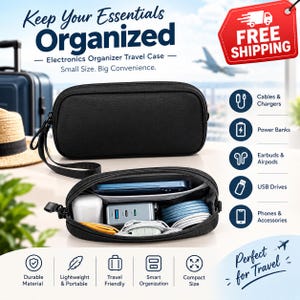May include: A black electronics organizer travel case with a wrist strap. The case is shown closed and open, revealing internal compartments containing a smartphone, a power adapter, charging cables, and various small electronic accessories.