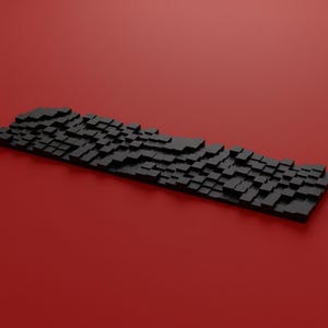Puede incluir: Un teclado rectangular que presenta una colección de teclas negras cuadradas de alturas variables, creando una textura de superficie irregular y tridimensional en toda la disposición del dispositivo sobre un fondo rojo sólido.