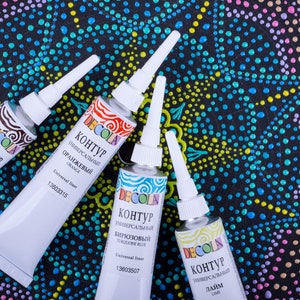 May include: Four tubes of DecoLa paint with different colors: brown, orange, turquoise, and lime. Each tube has a white cap and a label with the text "Контур" and the color name in Russian.