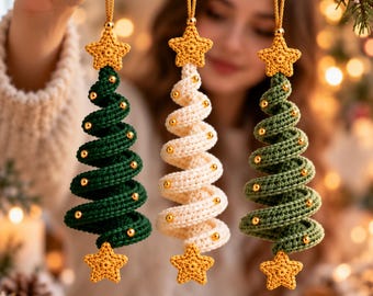 May include: Three spiral-shaped Christmas tree ornaments made of crocheted yarn. Each tree features a gold star at the top and bottom, with small gold beads attached along the spiral. The trees are colored dark green, cream, and sage green.