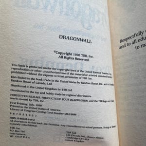 May include: The copyright page of the book Dragonwall, published in 1990 by TSR, Inc. The text includes the copyright notice, distribution information for the United States, Canada, and the United Kingdom, the ISBN 0-88038-919-2, and company addresses.