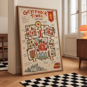 May include: A framed poster featuring a hand-drawn floor plan of Gryffindor Tower. The illustration includes labels for rooms like the Common Room, Dormitory, and Dining Area, with a red lion crest, small stars, and the text Gryffindor Tower Floor Plan.