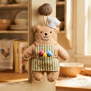 Cute Baker Bear felt ornament wearing a chef hat and green apron