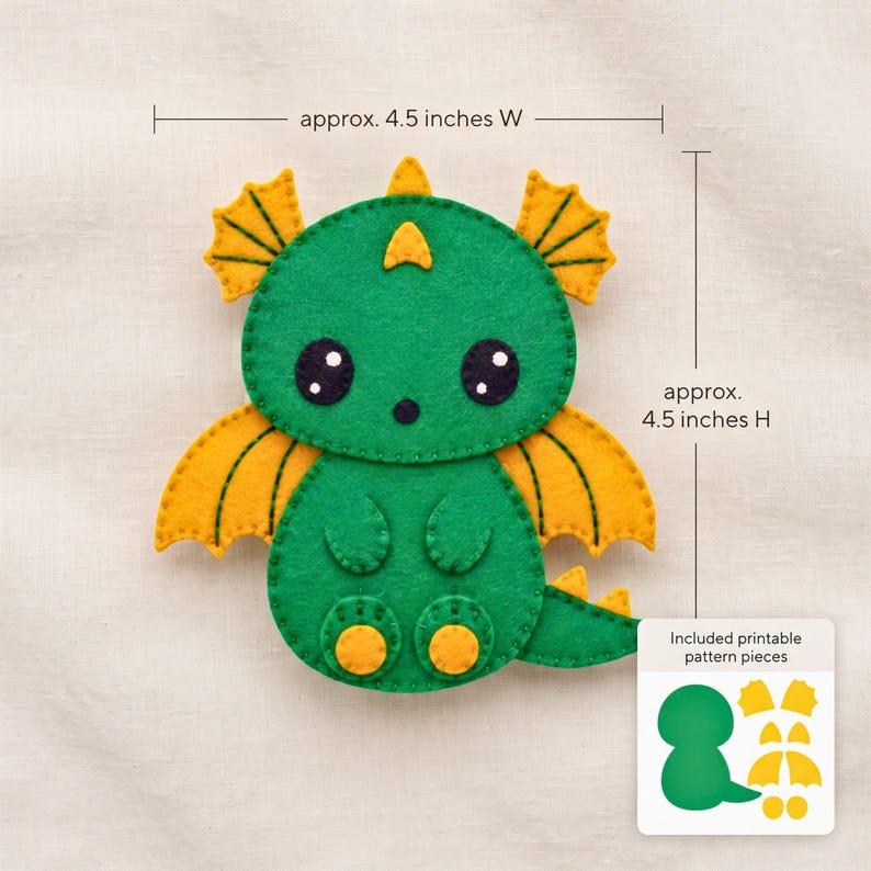 Kawaii dragon felt ornament pattern showing the approximately 4.5 by 4.5 inch finished size, 1-inch scale reference and measured template pieces.