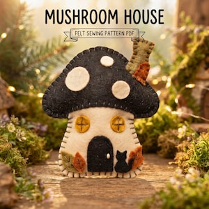 May include: A felt mushroom house sewing pattern PDF featuring a black cap with white spots, a cream-colored stem, two yellow windows, a black door, and a black cat silhouette. The design includes decorative felt leaves and a small chimney.