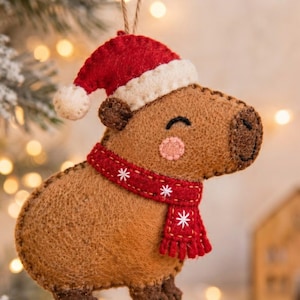 Close-up of the hand-stitched wool felt capybara ornament highlighting detailed embroidery and texture.