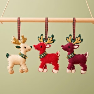 Handmade felt reindeer ornament packaged in gift box with plaid ribbon for Christmas gifting