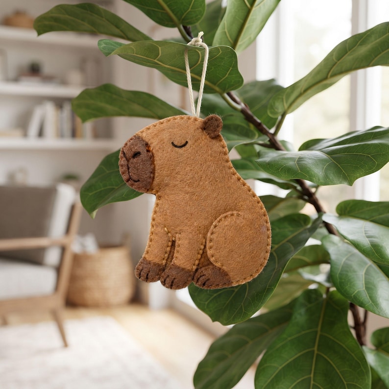 Capybara felt sewing pattern pieces including the body, snout, ear, front paws and back paw with printed measurements.