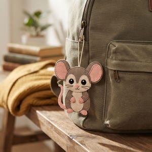 Dumbo Rat felt ornament with a hanging loop, oversized ears, embroidered whiskers and smile, cream facial details, and a pink curled tail.