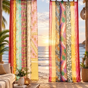 May include: Two sheer curtain panels featuring vertical stripes of varying widths in vibrant colours including red, yellow, pink, green, and purple. The fabric displays diverse floral and geometric patterns throughout, with tab-top headers for hanging.