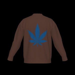 May include: A brown long-sleeve sweatshirt featuring a large, centered blue cannabis leaf graphic on the back. The garment has a crew neckline, long sleeves with ribbed cuffs, and a solid brown base color that contrasts with the blue leaf design.