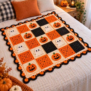 May include: A square crochet blanket featuring a grid of alternating orange, black, and cream-colored squares. The design includes appliqued motifs of smiling jack-o'-lanterns and white ghosts. The blanket has a scalloped black and orange border.
