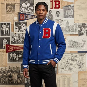 May include: A blue varsity jacket with white sleeves and a large red letter B patch on the chest. The jacket features a snap-button front closure, white striped ribbed trim on the collar, cuffs, and hem, and two vertical white-trimmed pockets.