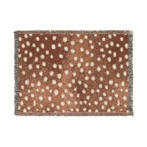May include: A rectangular woven throw blanket featuring a brown background with a repeating pattern of small, off-white circular spots. The blanket has a textured, fringed edge along all four sides, showcasing a multi-colored thread detail.