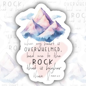May include: A sticker featuring a watercolor illustration of a mountain range in shades of purple and blue. The sticker includes the text "when my heart is overwhelmed, lead me to the ROCK that is higher than I." Psalm 61:2.