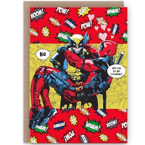 May include: Greeting card featuring comic book characters Wolverine and Deadpool. The card has a red background with action words and heart graphics. Deadpool is holding Wolverine, with the text "Will you Be My Valentine?"