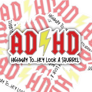 May include: A set of 10 red and white stickers with the text "ADHD" in a rock band font with a yellow lightning bolt. The text "Highway To...Hey Look A Squirrel" is written below the band name.