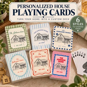 May include: Six decks of personalized playing cards featuring house illustrations and the text The Johnson home est. 2026. The cards display various border patterns including green gingham, blue stripes, blue checks, and red hearts.