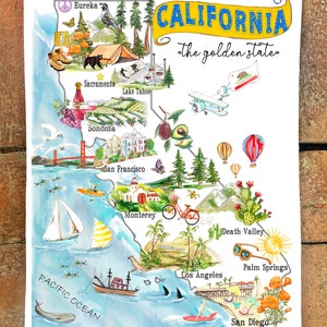 May include: A watercolor illustration of a map of California with various landmarks and icons. The map is titled "California - the golden state".  The map includes icons for Eureka, Sacramento, Lake Tahoe, Sonoma, San Francisco, Monterey, Death Valley, Palm Springs, Los Angeles, and San Diego.