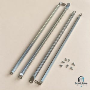 May include: Four long, thin, silver-coloured metal support bars with angled mounting brackets at each end. The bars feature a central ridge and are accompanied by six small, silver-coloured metal screws. The logo Smart Spare Solutions is visible.