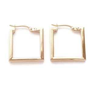 May include: A pair of gold-toned square hoop earrings featuring a polished metallic finish. Each earring is constructed with a hinged post mechanism at the top, allowing the square frame to open and close securely for placement through the earlobe.