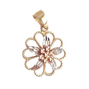 May include: A flower-shaped pendant crafted from yellow and white gold. The outer petals consist of twisted yellow gold wire, while the inner petals feature faceted white gold and a central cluster of small, textured yellow gold spheres.