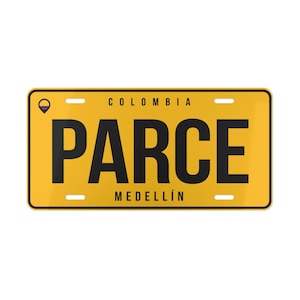 May include: A rectangular yellow license plate with black text reading PARCE in the center. Above the text is COLOMBIA and below is MEDELLÍN. A small circular icon featuring the yellow, blue, and red Colombian flag is located in the top left corner.