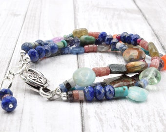 Bracelet 3 strands include jasper, rhodonite, iolite, fluorite, turquoise, garnet, carnelian, kyanite, lapis. Handmade in Colorado Colorful