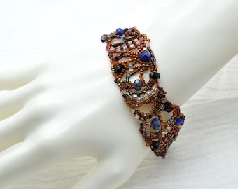 Bracelet, Freeform Peyote stitch bracelet with Lapis and black crystals, Adjustable fit.  Handmade in Colorado